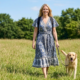 puppy leash training in the farm .a golden puppy walking with leash .puppy leash in the hand of female