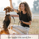 Young woman using positive reinforcement techniques during a puppy obedience training session outdoors with a Beagle puppy.